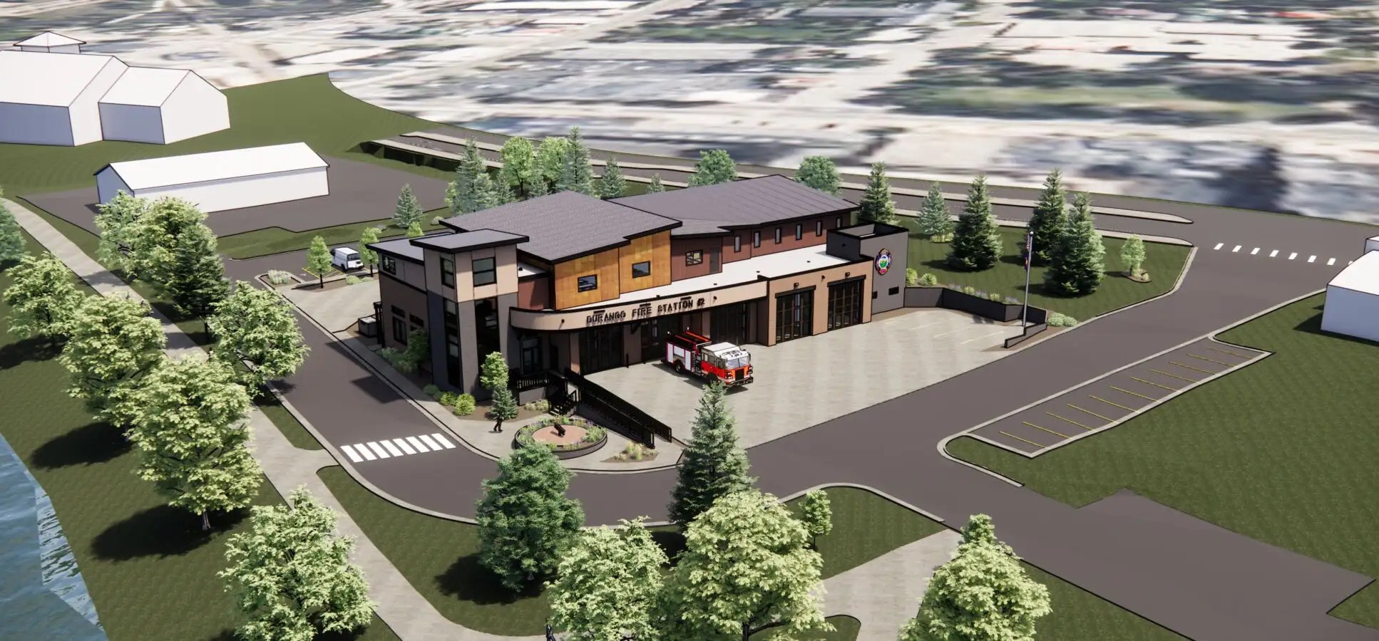 A 3D rendering of a modern fire station with a parked fire engine, landscaping, and surrounding area.