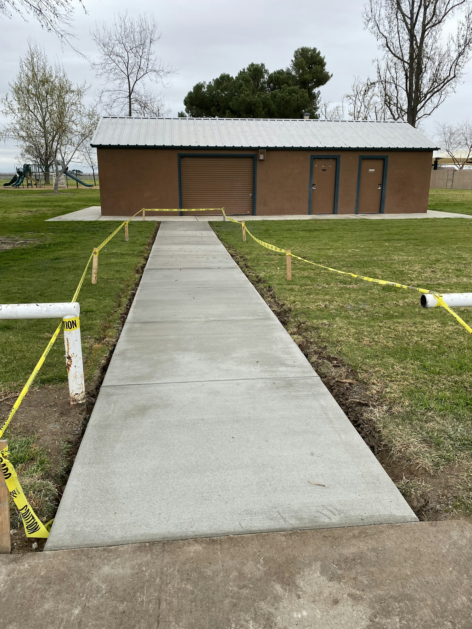 May contain: sidewalk, path, outdoors, housing, building, architecture, driveway, house, and aerial view