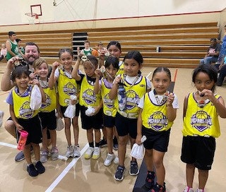 May contain: people, person, clothing, footwear, shoe, child, female, girl, accessories, bag, handbag, jewelry, and necklace