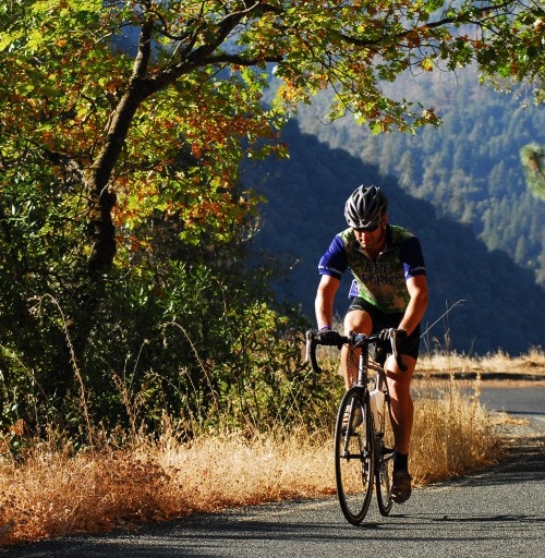 May contain: helmet, bicycle, cycling, person, sport, transportation, vehicle, clothing, footwear, shoe, and glove