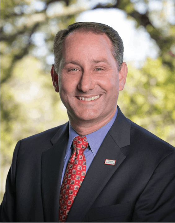 May contain: accessories, formal wear, tie, necktie, adult, male, man, person, clothing, suit, face, head, photography, portrait, happy, and smile