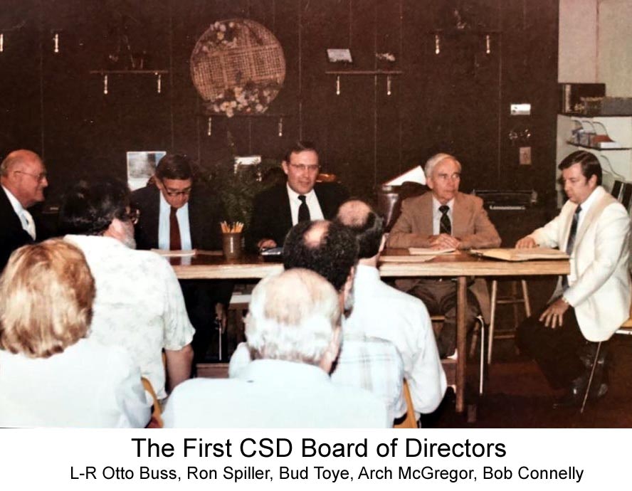 May contain: person, human, restaurant, tie, accessories, accessory, overcoat, clothing, suit, apparel, coat, and sitting