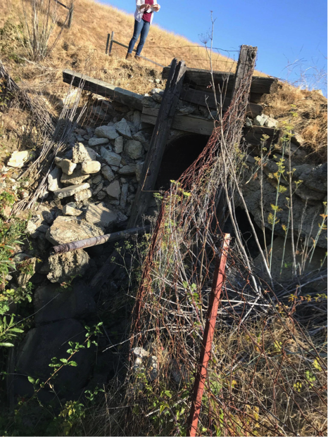 May contain: rock, architecture, building, outdoors, shelter, slate, rubble, bunker, nature, wilderness, person, and wall