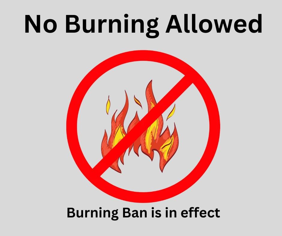 No Burning Allowed sign with flames crossed out; burning ban in effect.