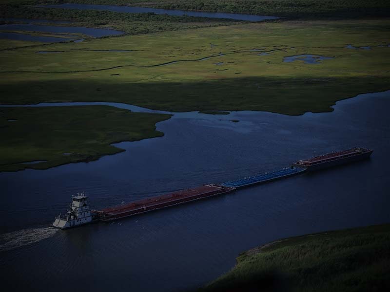 May contain: barge, boat, transportation, vehicle, watercraft, outdoors, water, nature, land, and waterfront