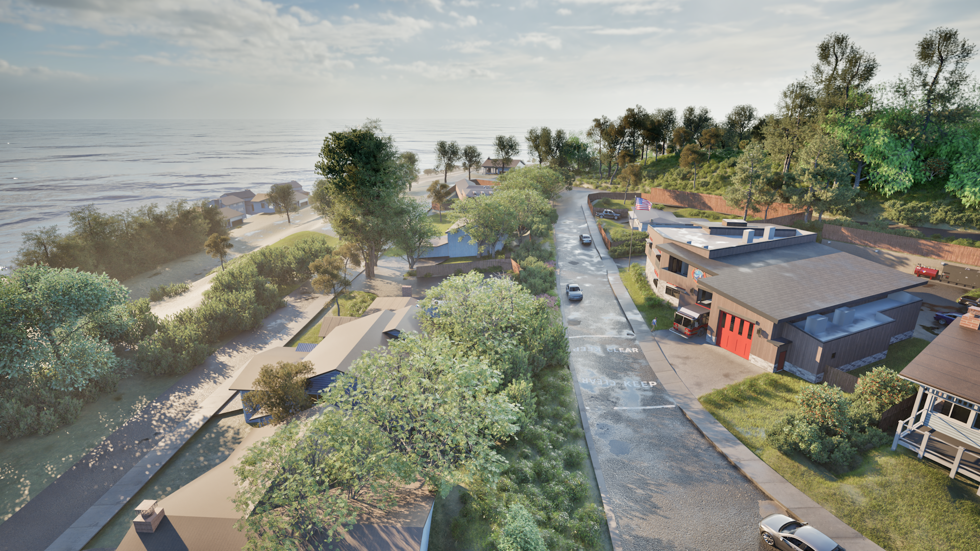 A coastal road with houses, trees, and a view of the ocean under a partly cloudy sky.