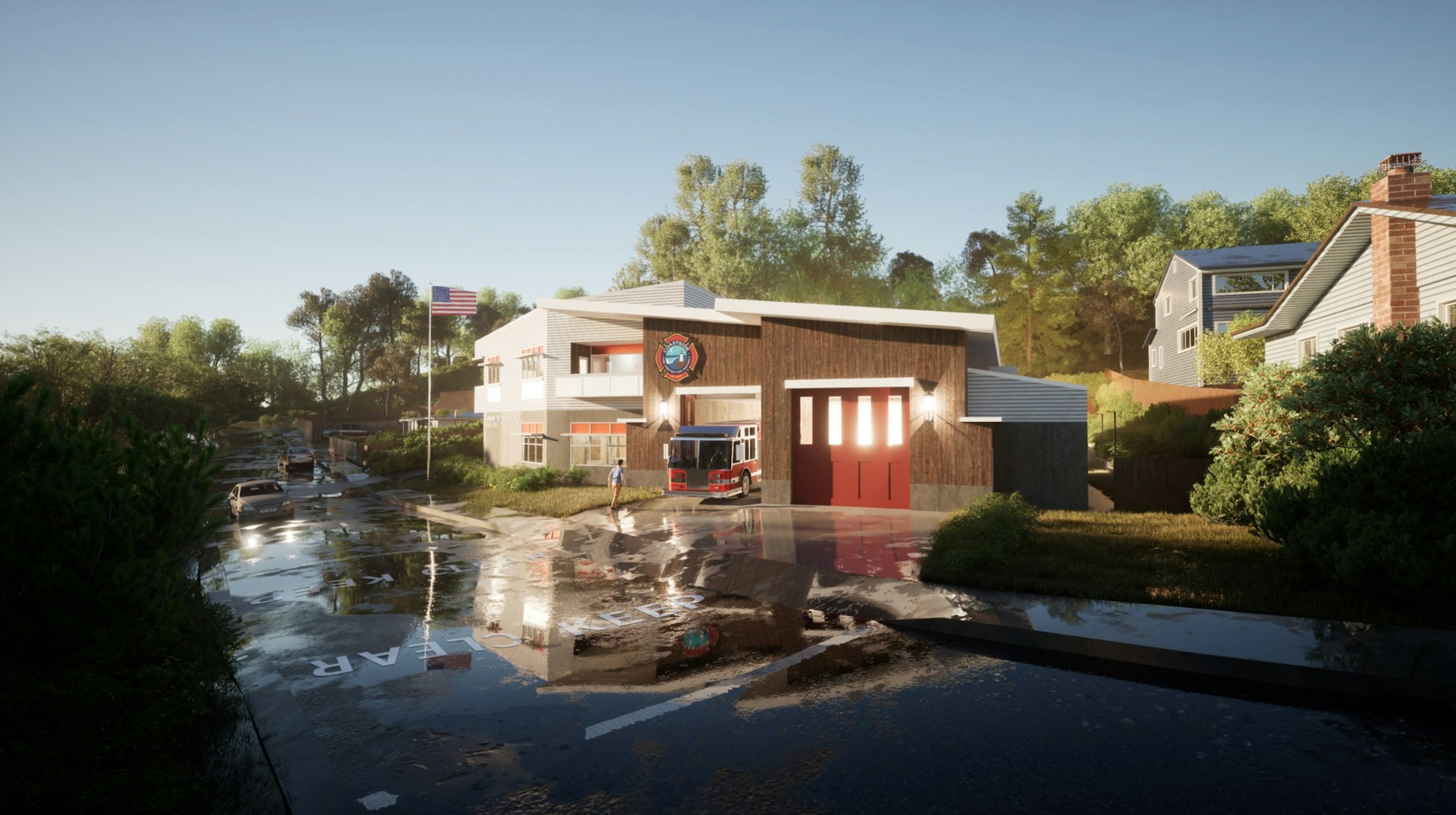 A fire station with an open door revealing a fire truck, wet street reflecting surroundings, American flag, and clear skies.