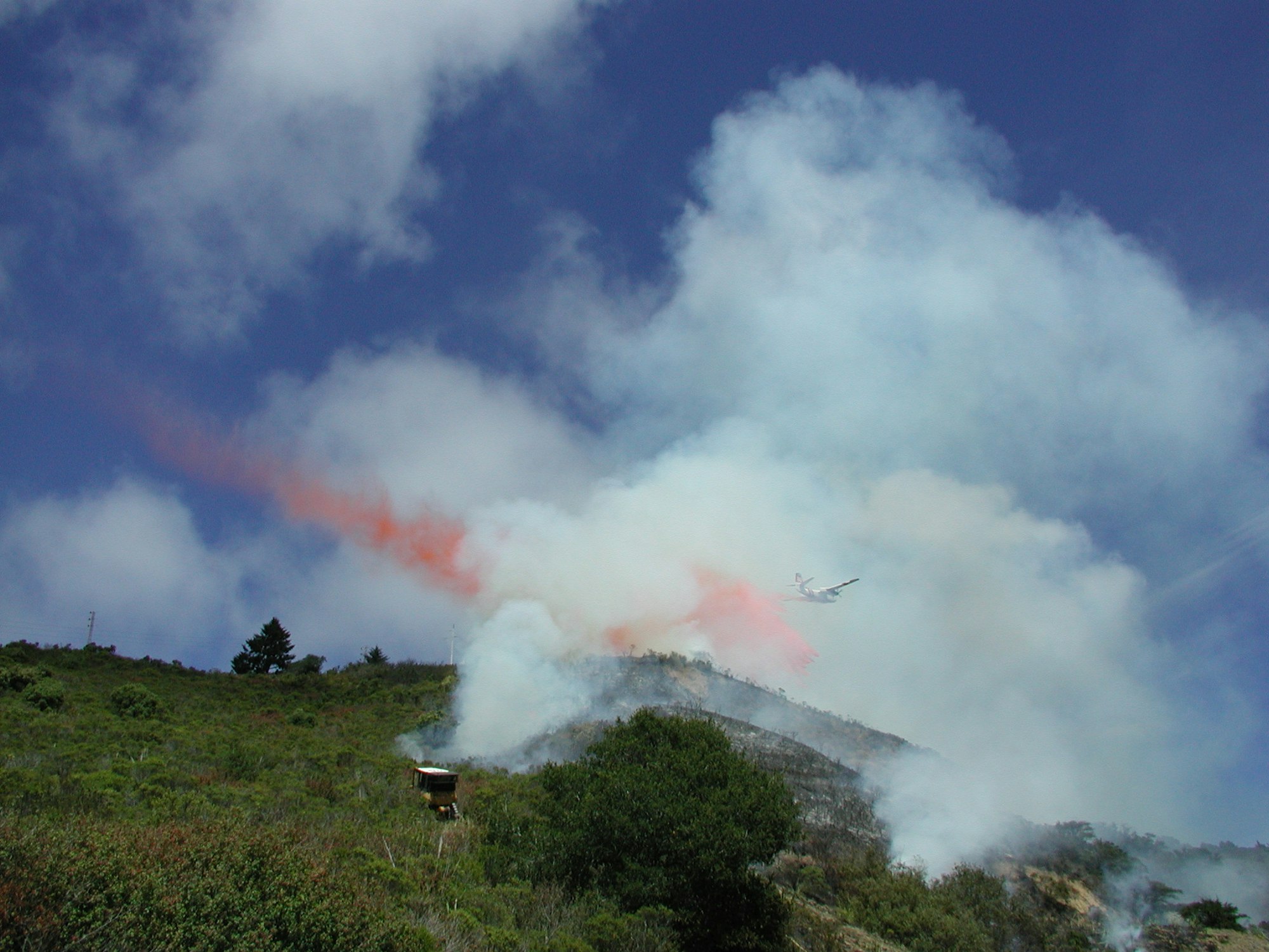 May contain: nature, mountain, outdoors, fire, airplane, transportation, aircraft, and vehicle