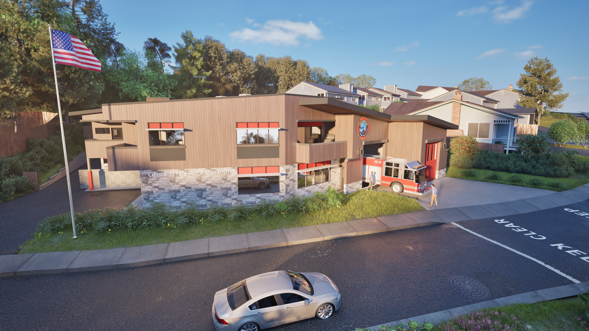 Modern fire station with an American flag, fire truck, and two people, set in a neighborhood with trees and houses.