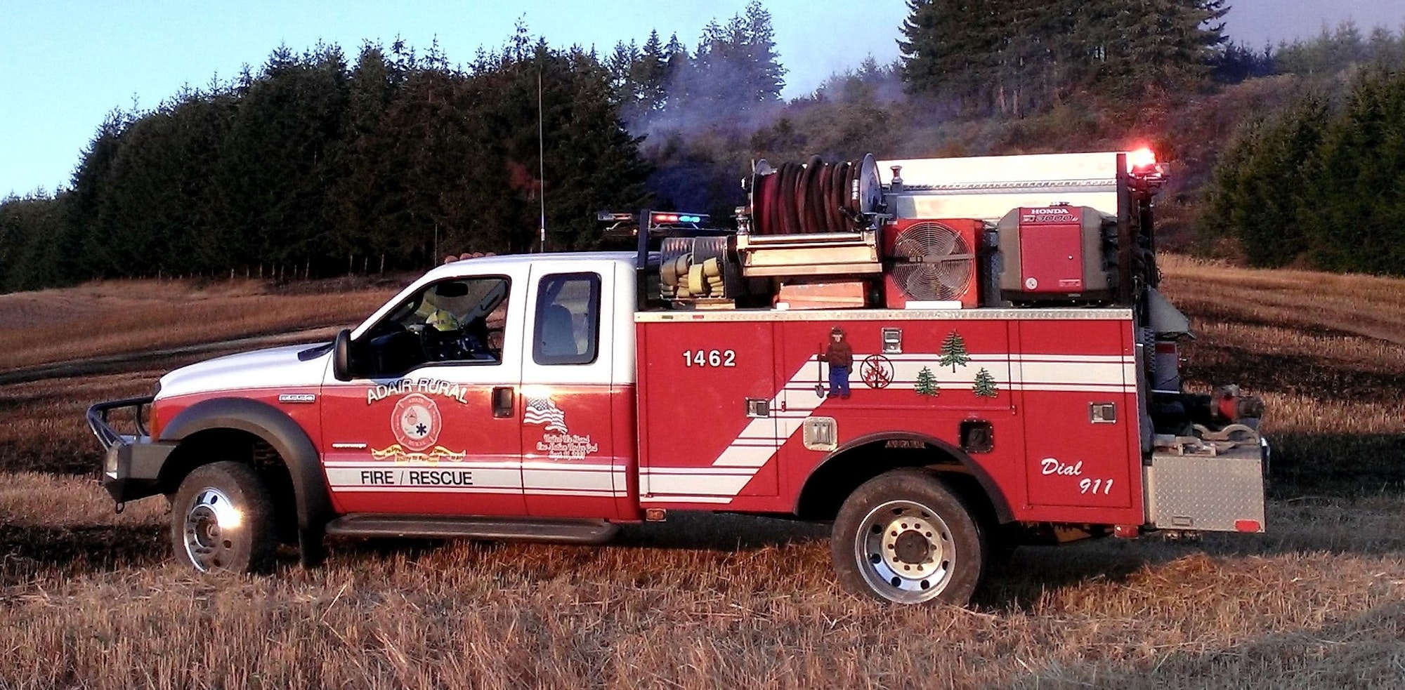 May contain: person, transportation, vehicle, chair, furniture, fire truck, truck, machine, and wheel