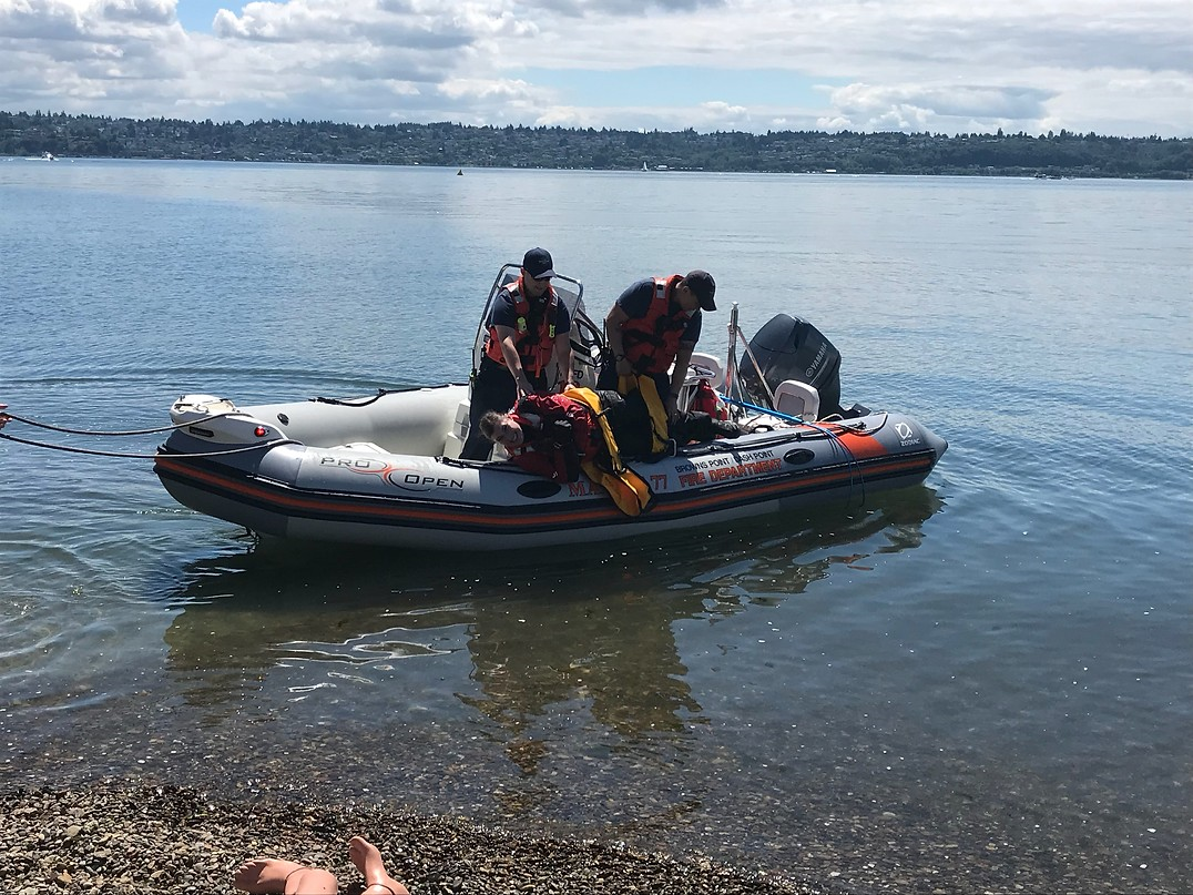 May contain: clothing, hat, boat, transportation, vehicle, person, rescue, and glove