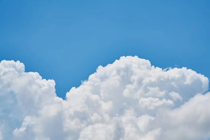 Blue sky with white puffy clouds