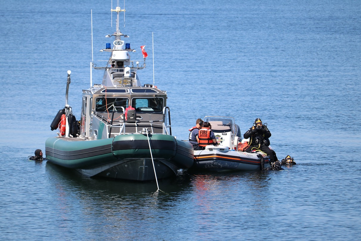 May contain: transportation, vehicle, watercraft, boat, person, clothing, glove, and helmet