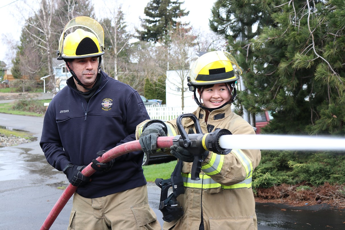 May contain: clothing, glove, helmet, adult, male, man, person, and fireman