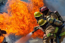 May contain: fire, extinguishing fire, and helmet