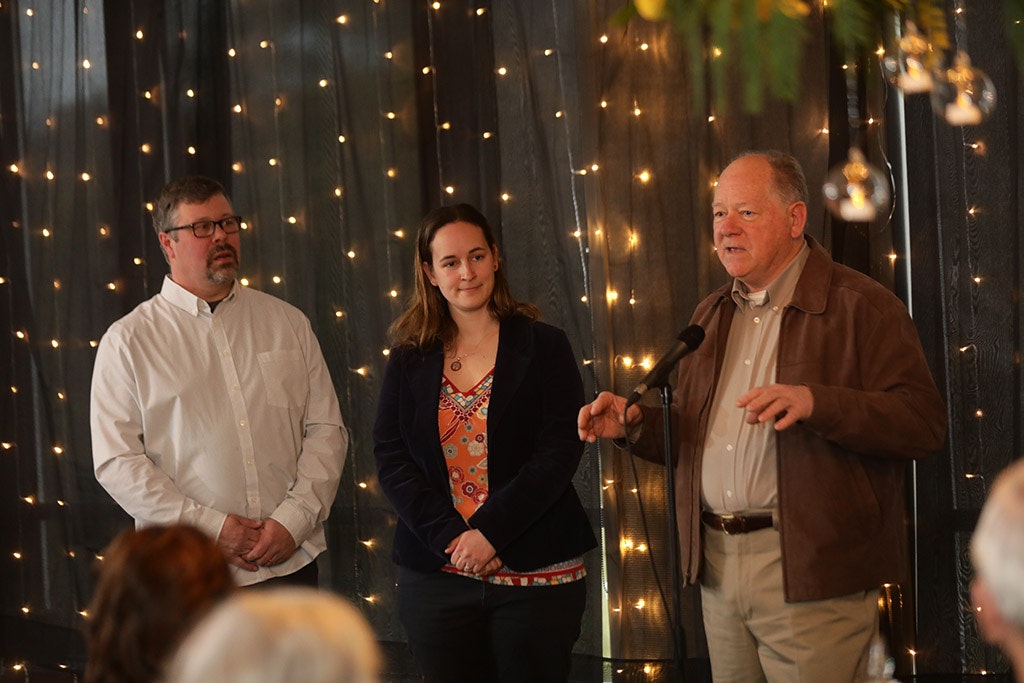 May contain: person, human, clothing, apparel, and sitting