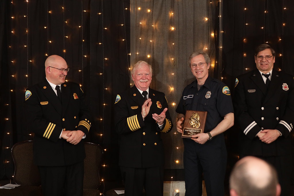 May contain: officer, military uniform, person, military, human, captain, suit, clothing, coat, overcoat, apparel, tie, accessories, and accessory