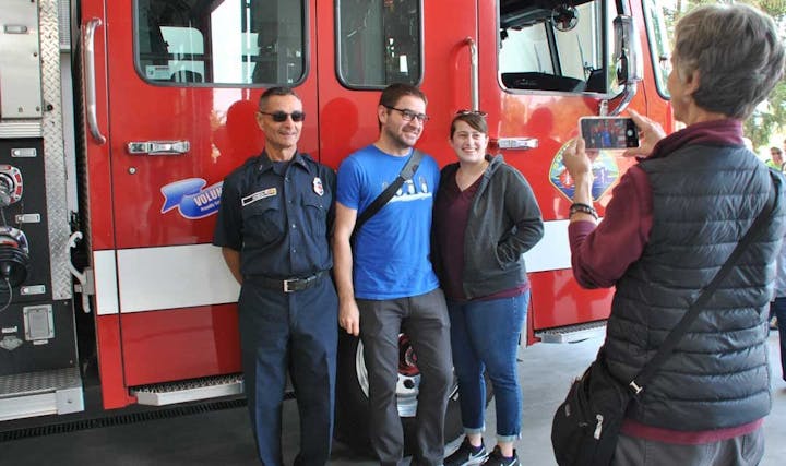 May contain: person, human, truck, transportation, vehicle, shoe, clothing, footwear, apparel, fire truck, sunglasses, accessories, and accessory