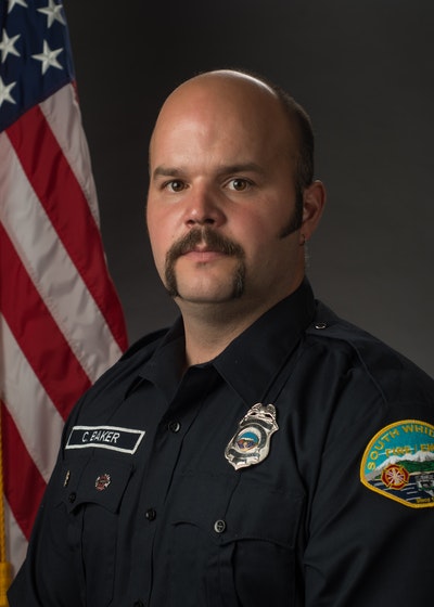 May contain: person, human, officer, military, military uniform, symbol, flag, and captain