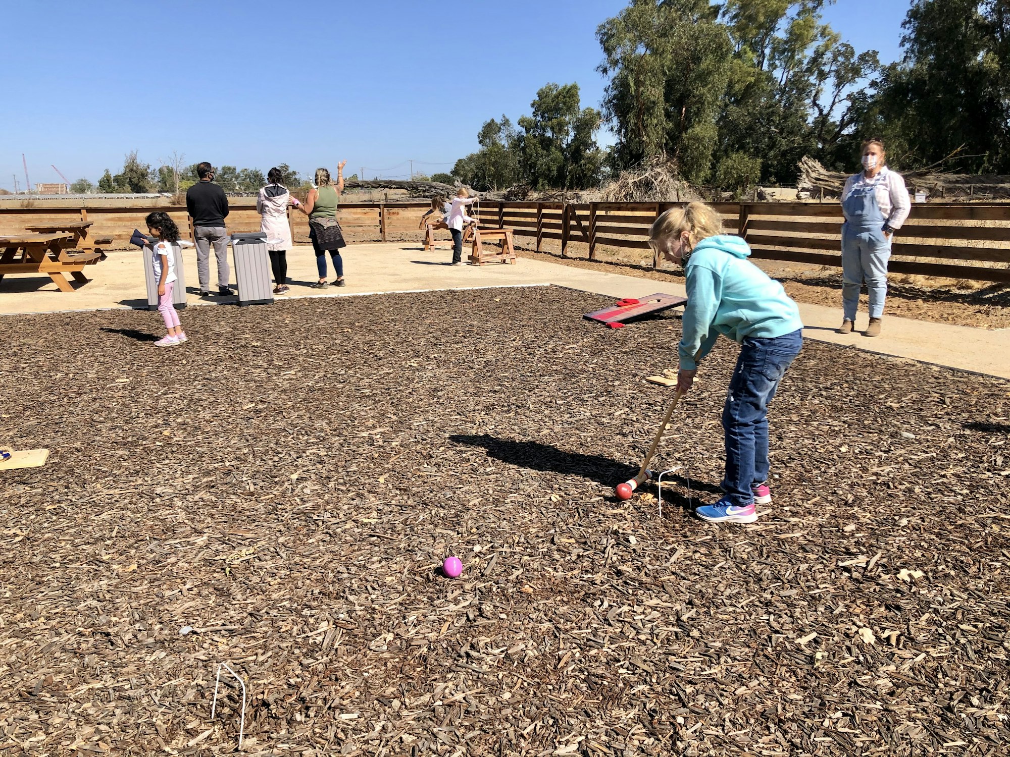 May contain: person, human, ground, play area, and playground