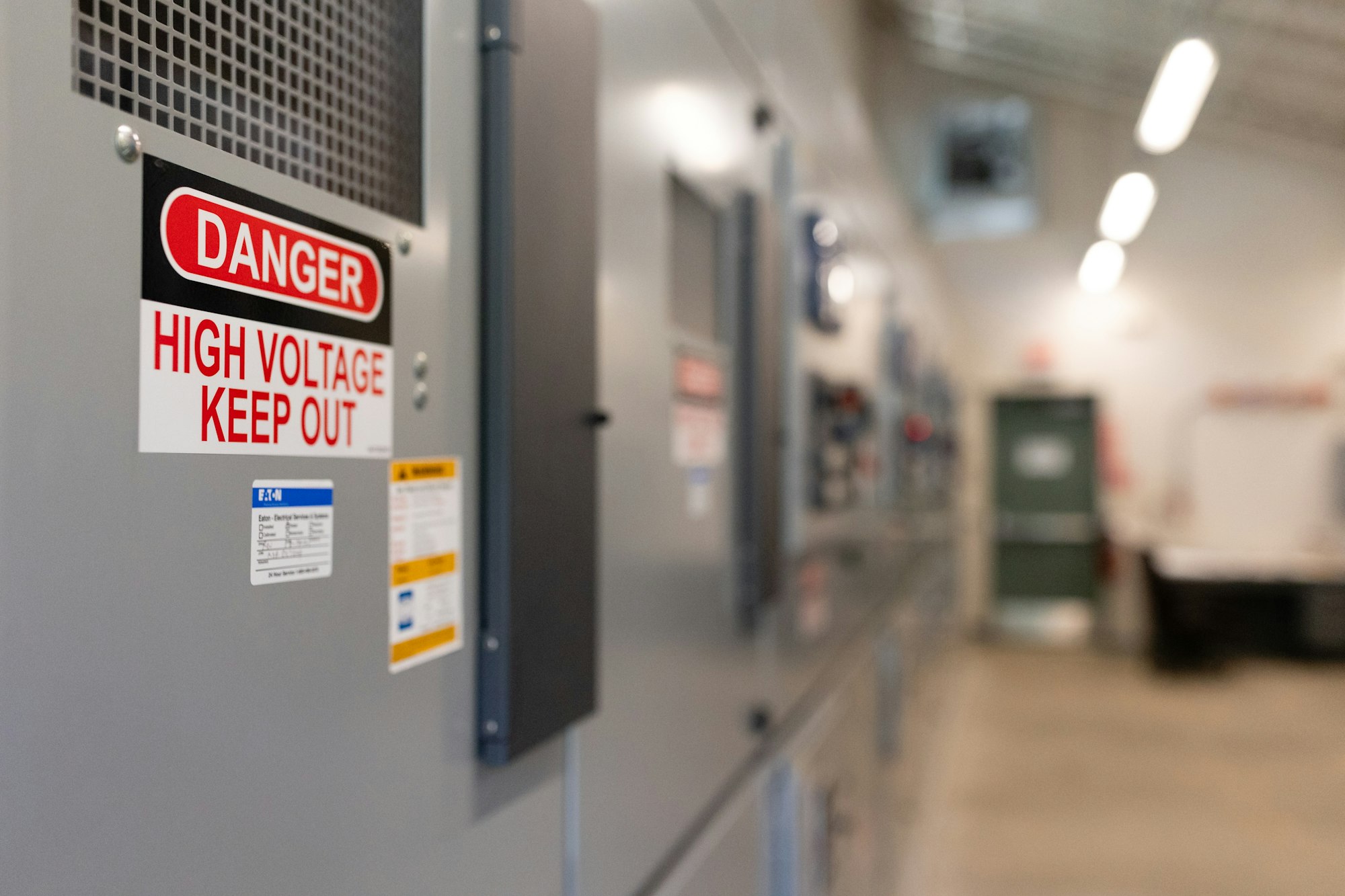 A "Danger: High Voltage Keep Out" sign on Luther Pass Pump Station control panel.