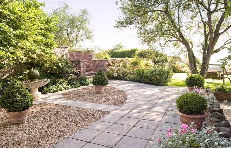 May contain: yard, outdoors, nature, path, vegetation, plant, walkway, and bush