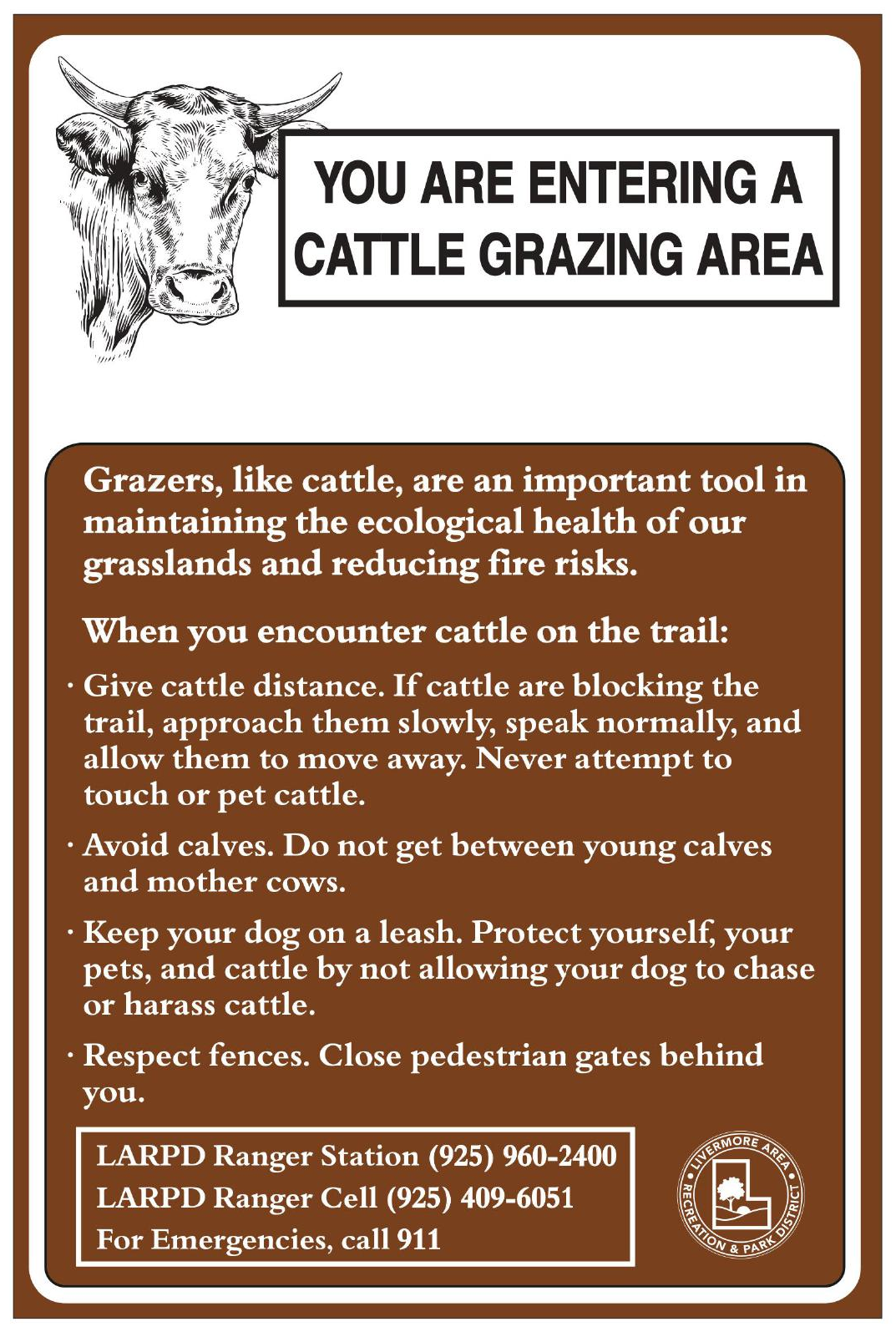 Sign: "You are entering a cattle grazing area." Guidelines for encountering cattle and contact info for emergencies.