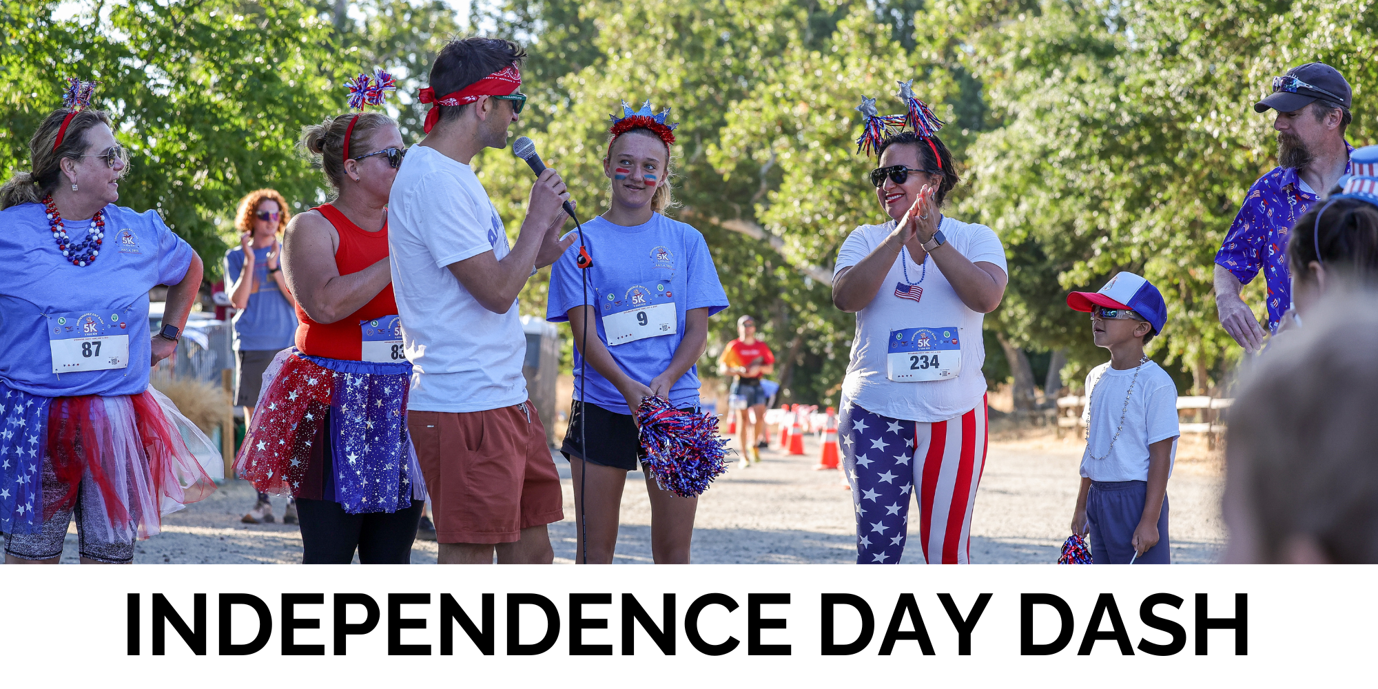 A festive gathering for an Independence Day 5K run, with participants in patriotic attire celebrating and preparing for the event.