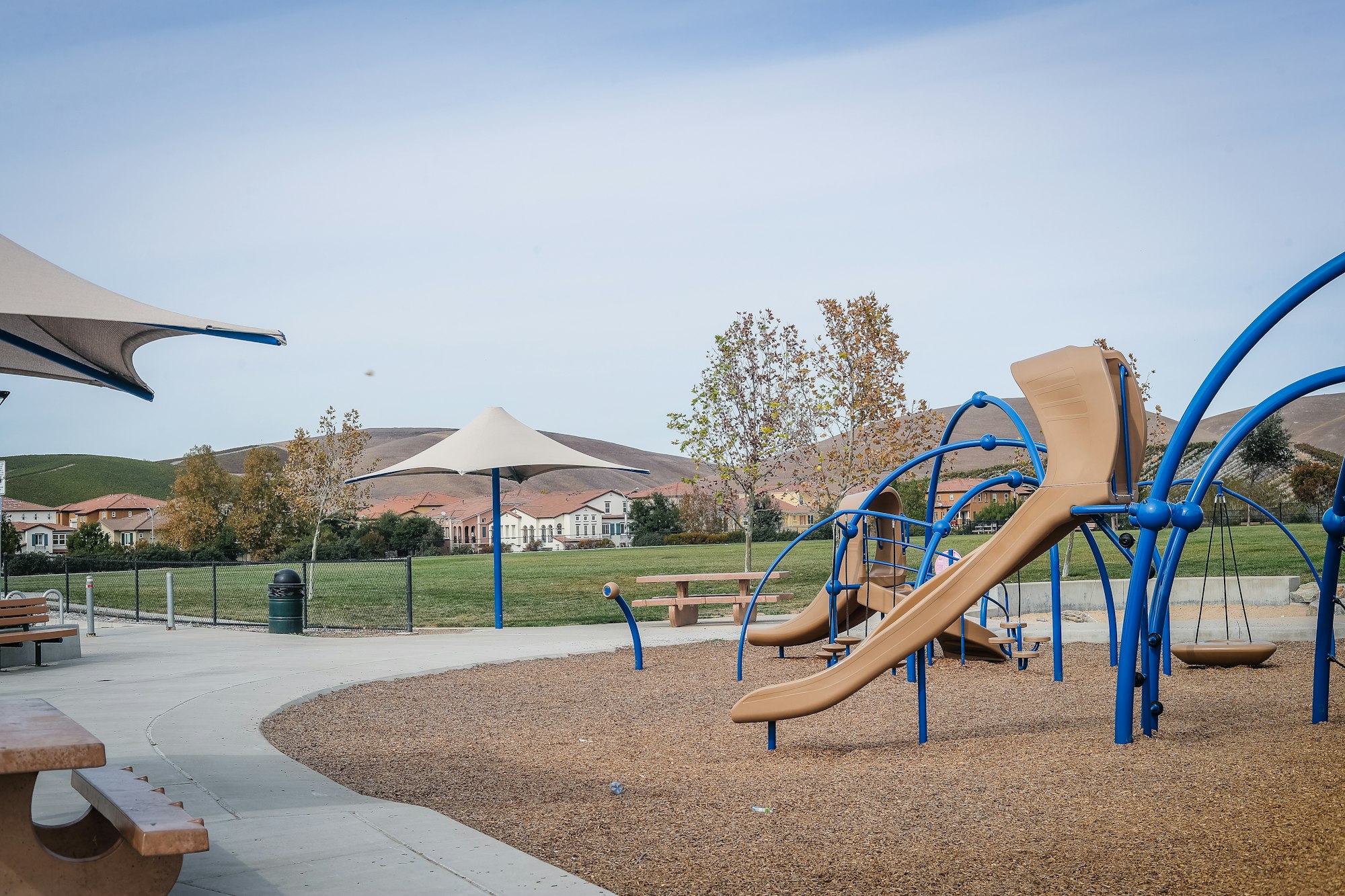 May contain: outdoor play area, outdoors, play area, bench, furniture, desk, and table