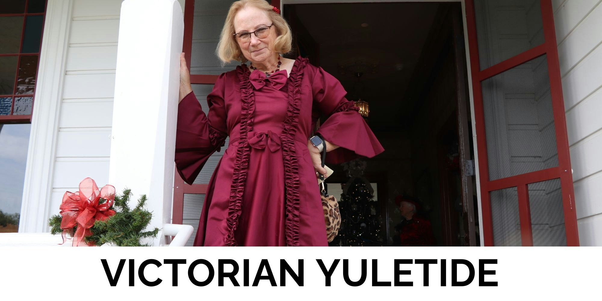 A person in a red Victorian dress stands by a decorated entrance, with "Victorian Yuletide" text below.