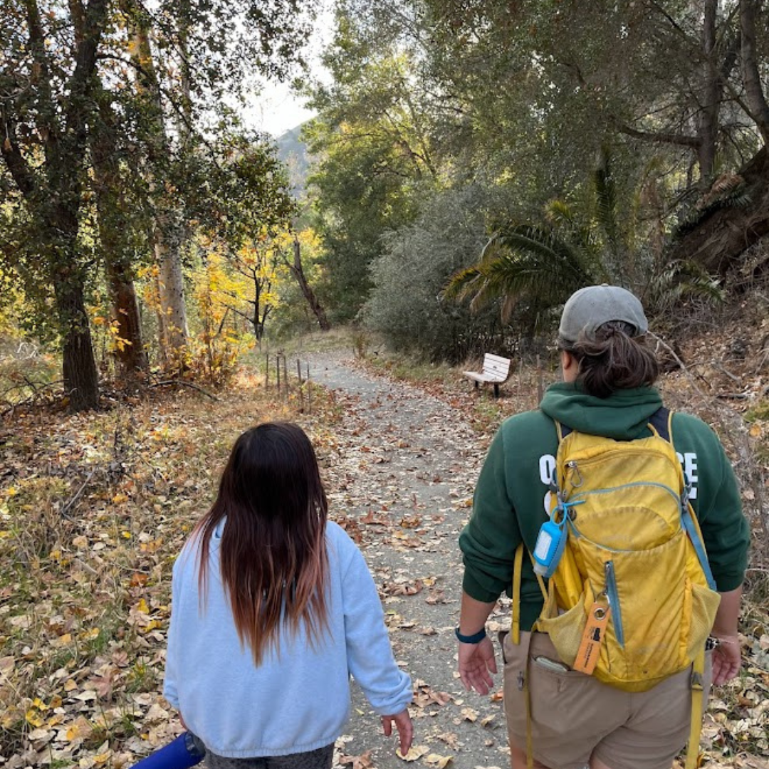May contain: bag, person, backpack, backpacking, bench, and furniture