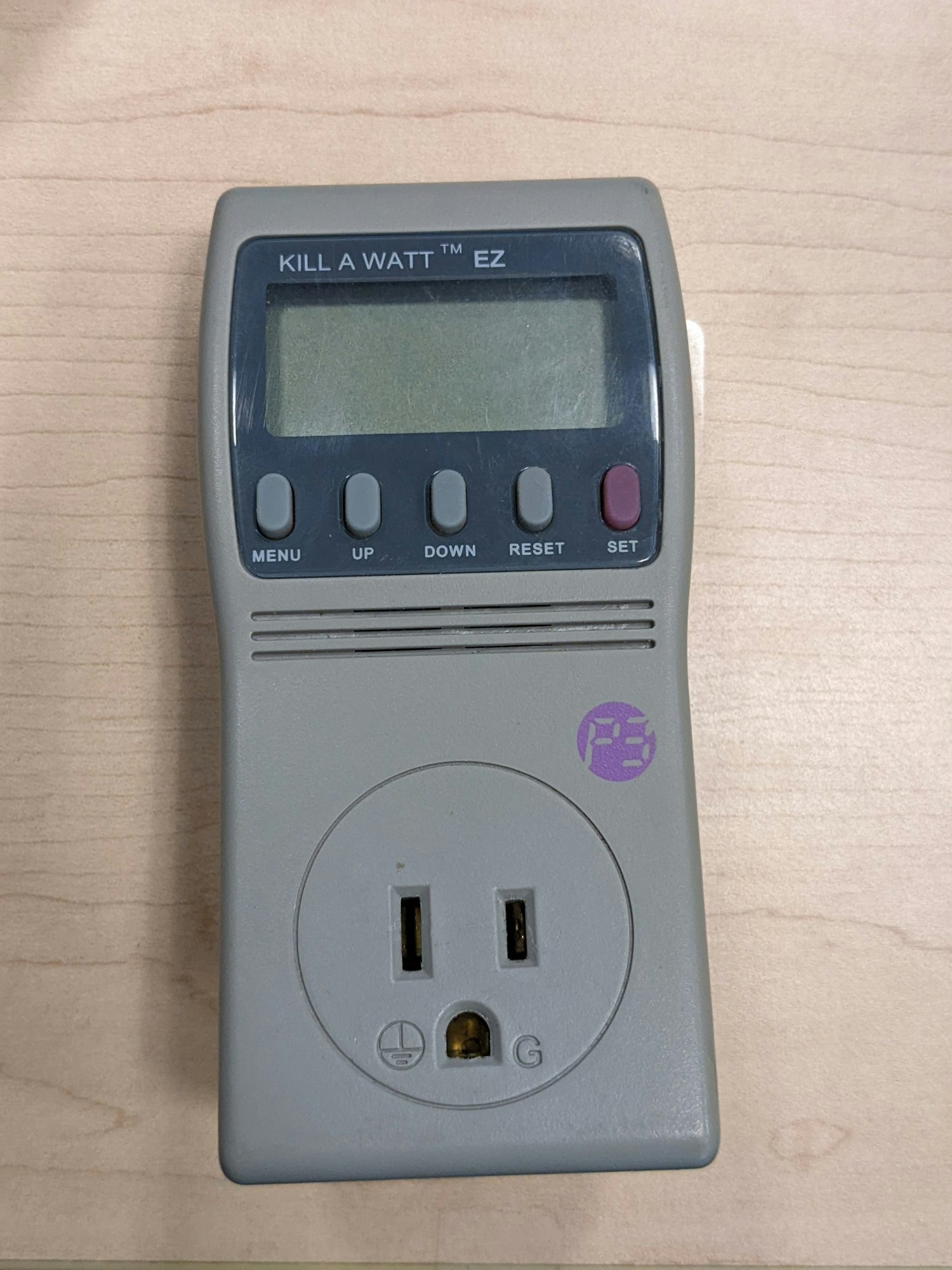 A Kill A Watt EZ power meter with display, control buttons, and an outlet plug.