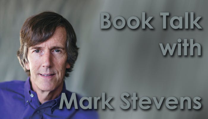 Man in a blue shirt with text: "Book Talk with Mark Stevens."