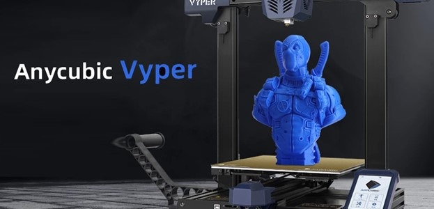 Anycubic Vyper 3D printer with a blue superhero-like bust being printed.