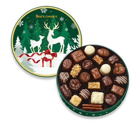 See's Candies holiday-themed tin with assorted chocolates.