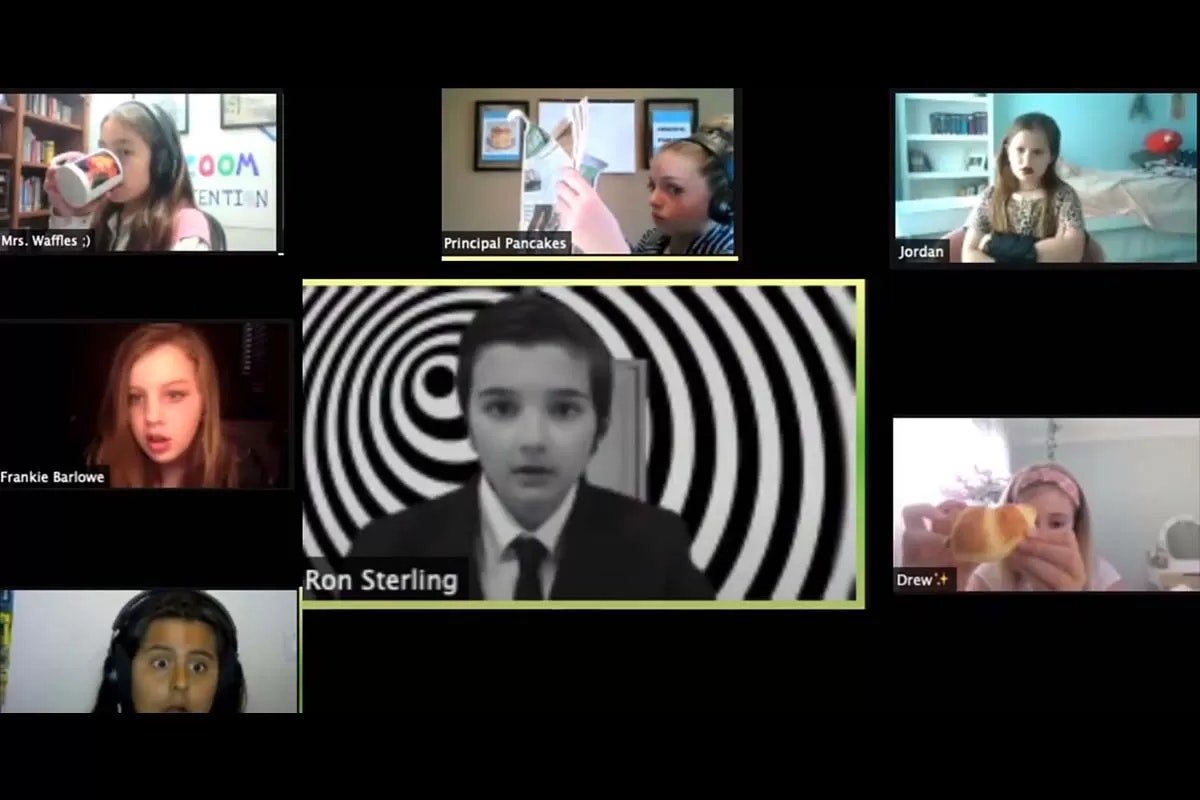 A virtual meeting with kids, each in their own video frame. One kid is in black and white with a spiral background.