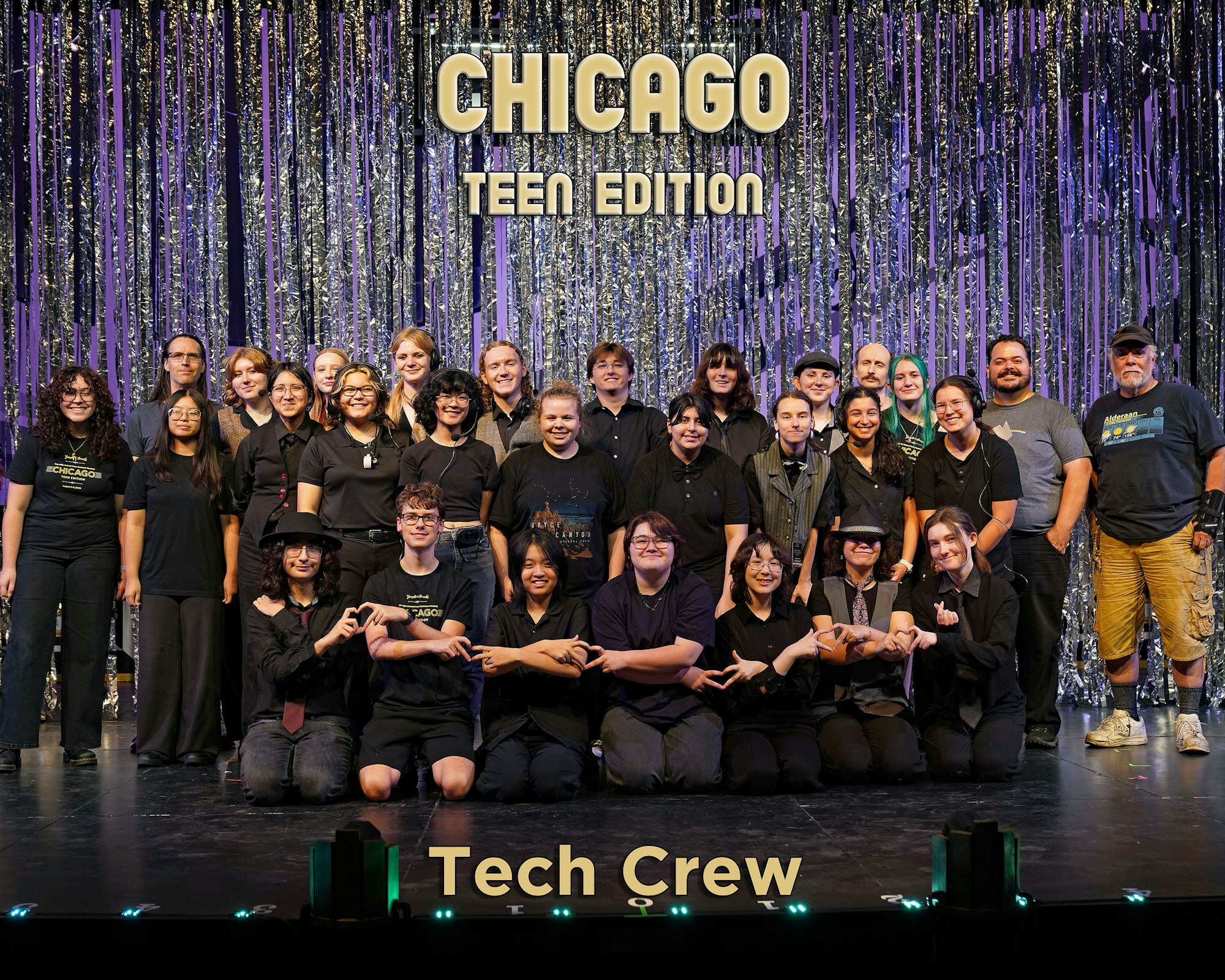 A group photo of the tech crew for "Chicago Teen Edition," posed on stage with a sparkling backdrop.