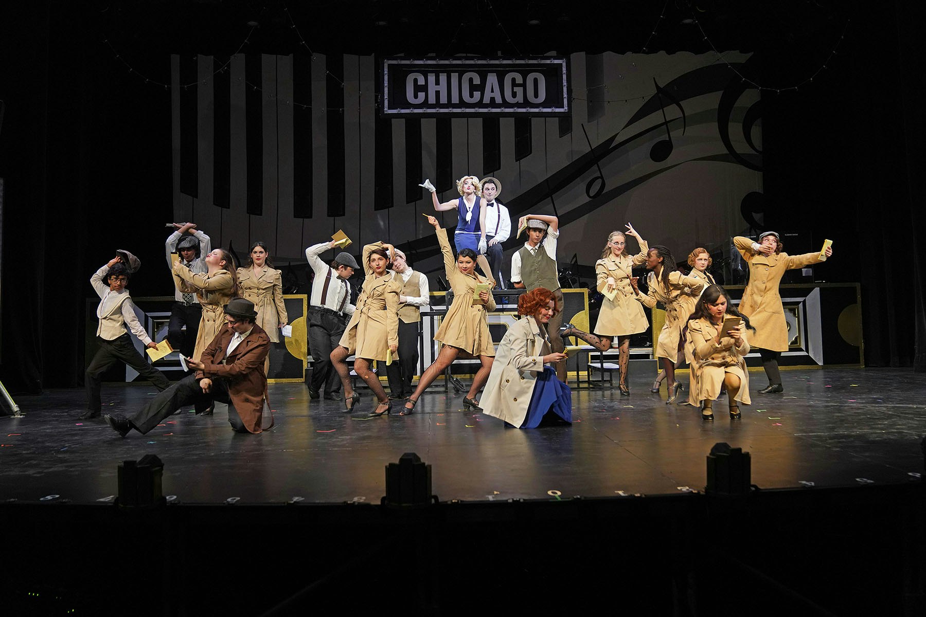 A vibrant theatre performance of "Chicago" with a cast in stylish costumes, dancing and acting on stage.