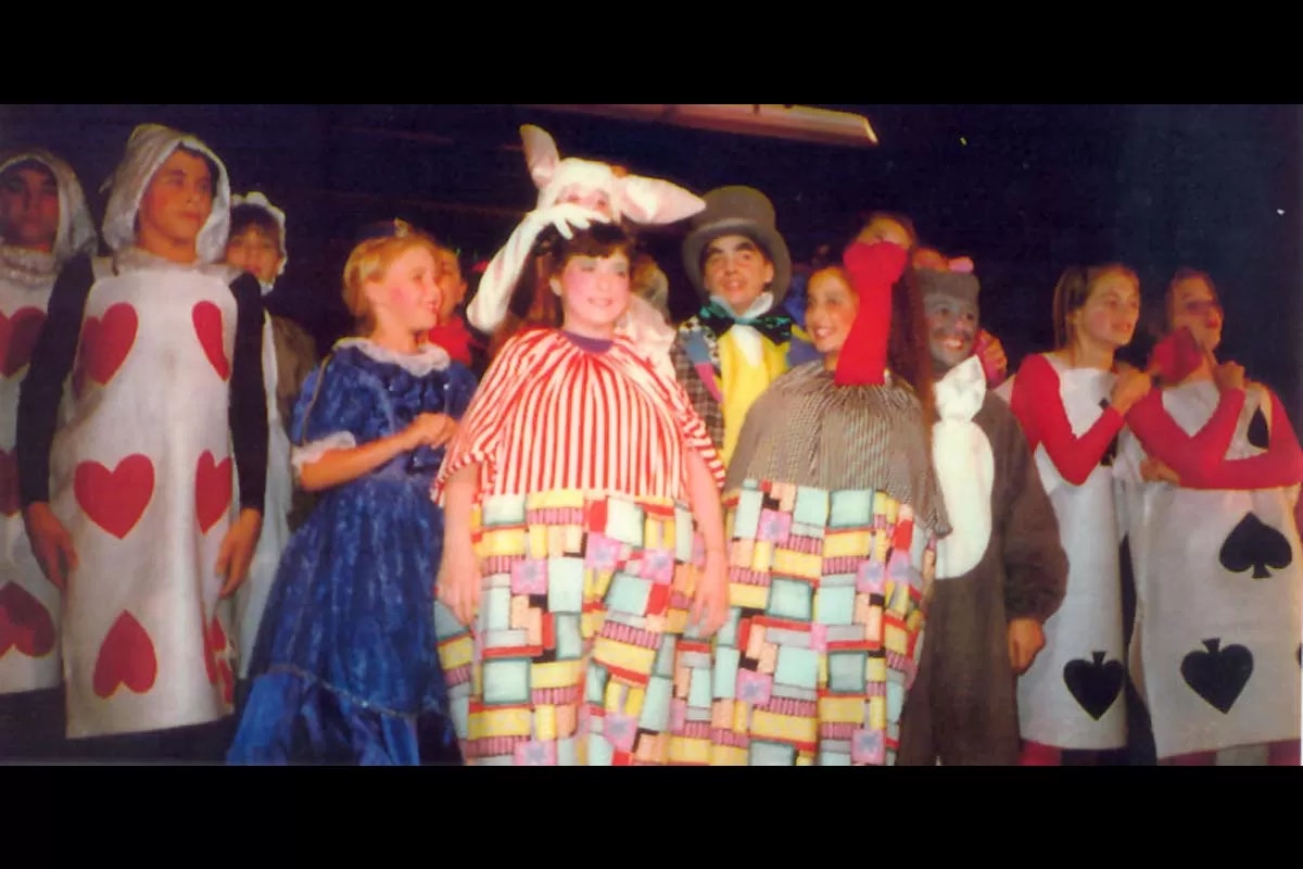 Children dressed in colorful costumes, likely for a theatrical play.