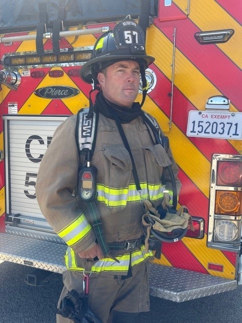 May contain: fireman, person, human, helmet, clothing, and apparel