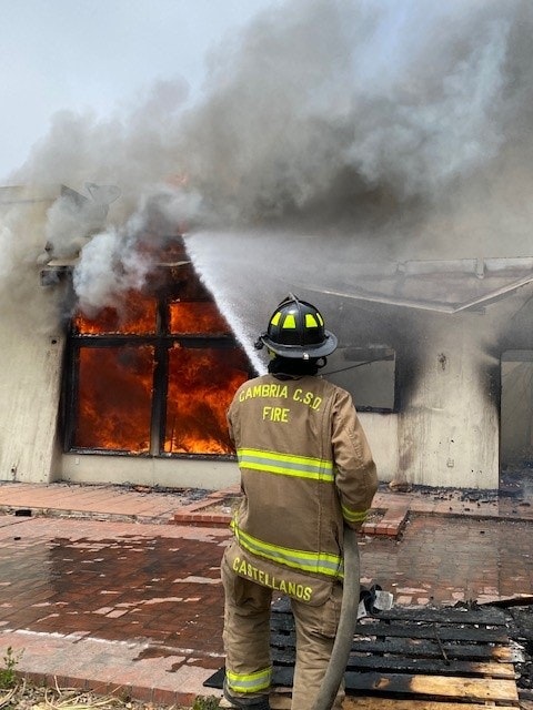 May contain: person, human, helmet, clothing, apparel, and fireman
