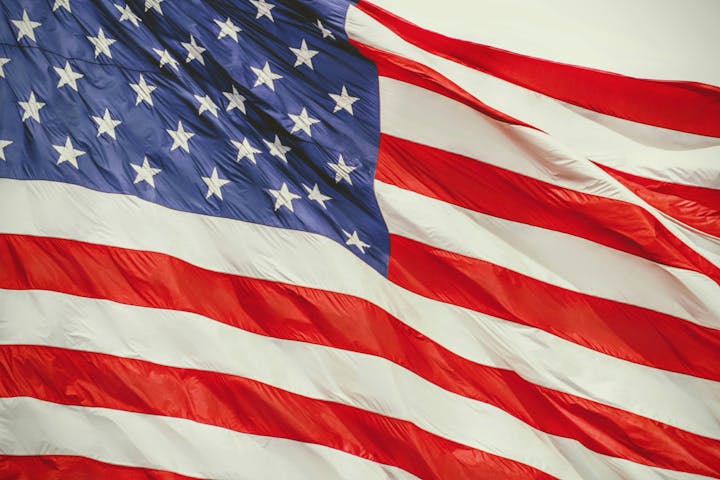 The image shows the United States flag with stars and stripes.
