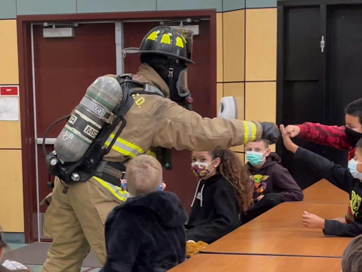 May contain: person, human, helmet, clothing, apparel, and fireman