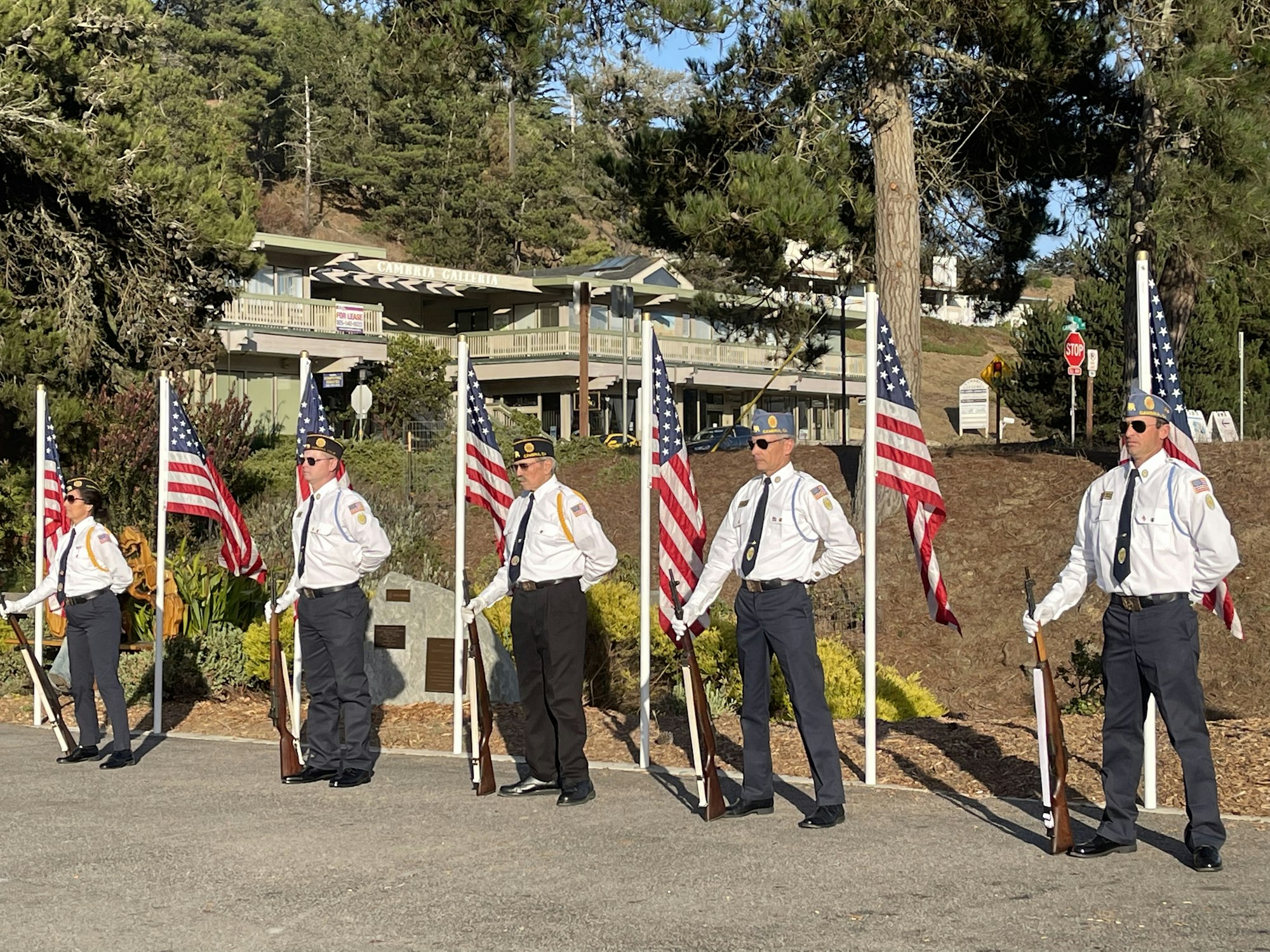 May contain: person, human, flag, symbol, military uniform, and military