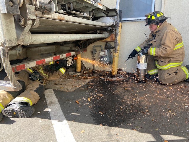 May contain: person, human, helmet, clothing, apparel, shoe, footwear, and fireman