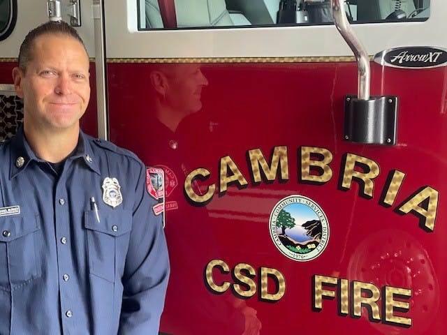 May contain: person, human, logo, symbol, and trademark