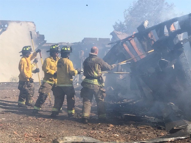 May contain: person, human, helmet, clothing, apparel, and fireman