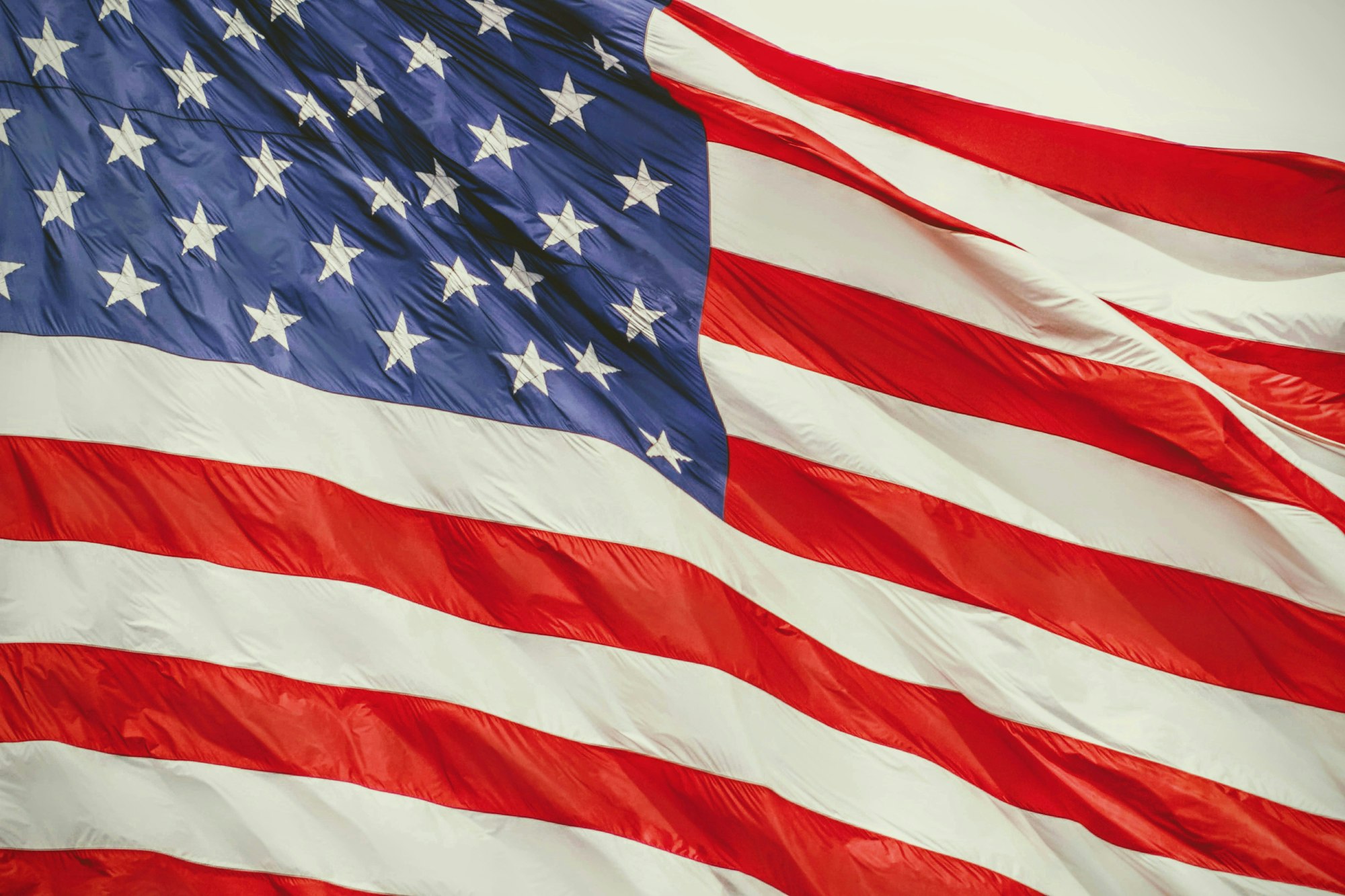 The image shows the United States flag with stars and stripes.