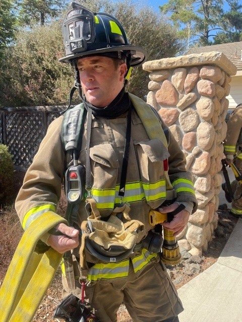 May contain: helmet, clothing, apparel, person, human, and fireman