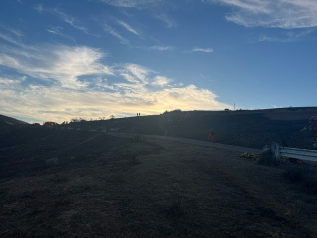 May contain: nature, outdoors, sky, cloud, scenery, landscape, land, horizon, grass, plant, vegetation, soil, person, and slope